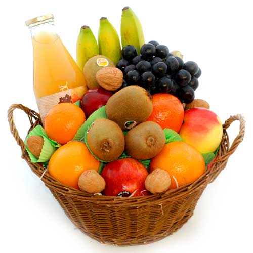 Basket of fruit with bottle of juice