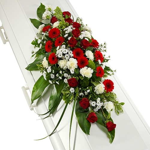Casket decoration of red and white flowers